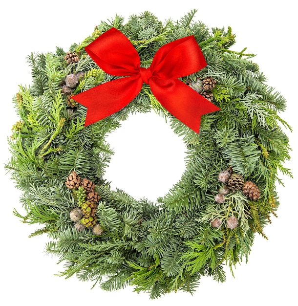 Christmas wreath from fir, pine and spruce twigs with cones and red ribbon bow isolated on white background