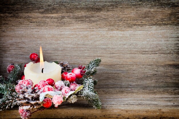 Christmas wreath from red berries, a fur-tree and cones