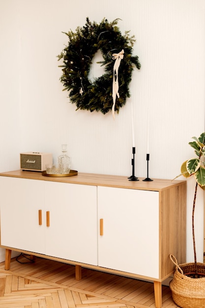 Christmas wreath and furniture in the bright living room