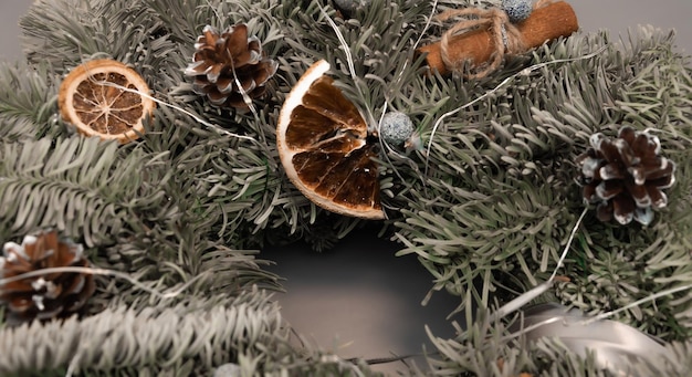 Christmas wreath in gray blue colors with gold made by hand from natural spruce at the master class