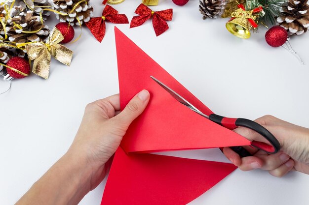 Christmas wreath made of colored paper. DIY concept. Handmade at home. Step-by-step instruction. Step 7.