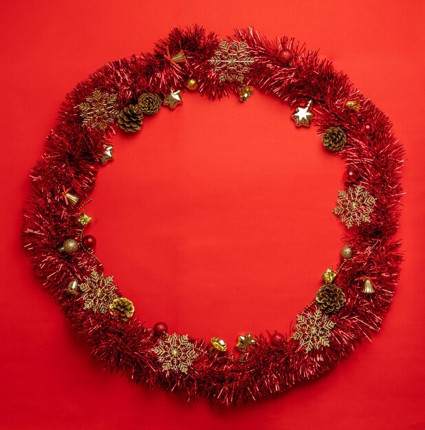 Christmas wreath on red background