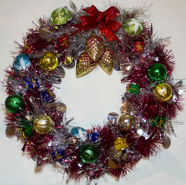 Christmas wreath of tinsel fir cones new year decorations isolated white background