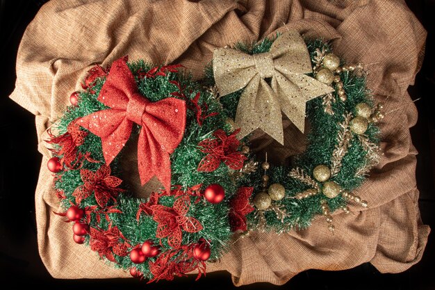 Christmas wreath, two beautiful Christmas wreaths on a table with rustic background, selective focus.