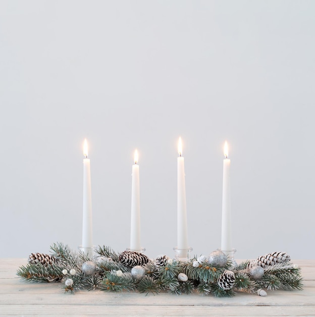 Christmas wreath on white wooden table