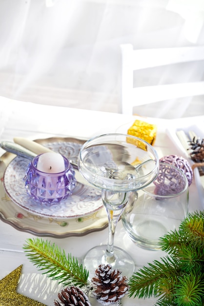 Christmas wreath with colorful big candles on a table