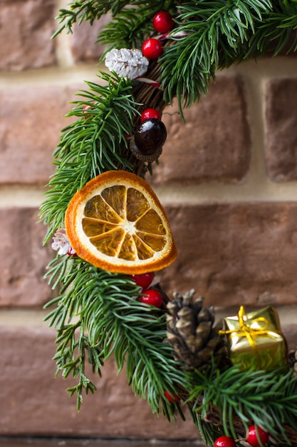 Christmas wreath with orange slices, cones