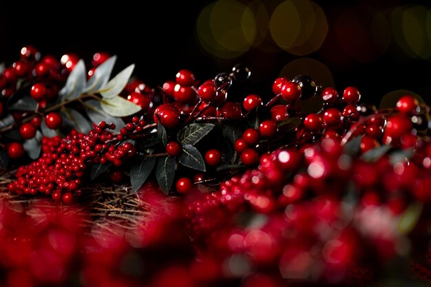 Christmas wreath with red berries on a dark background, christmas background. High quality photo