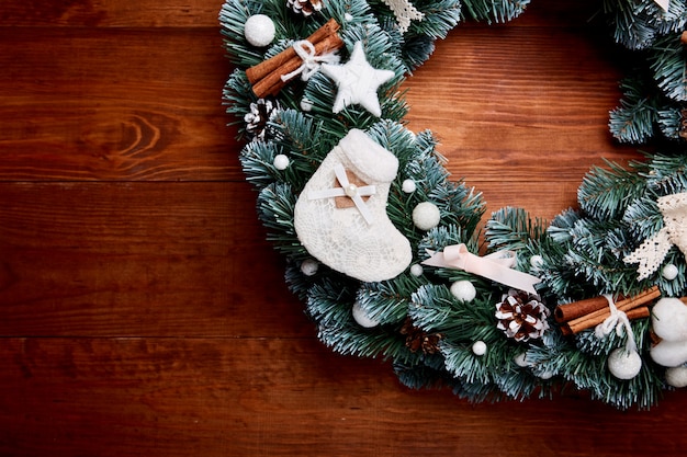 Christmas wreath on wooden background