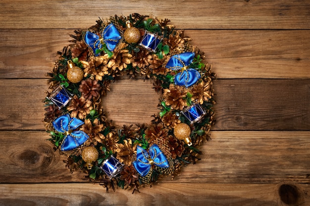 Christmas wreath on wooden background