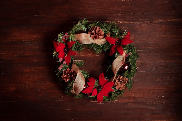 christmas wreath on wooden background.