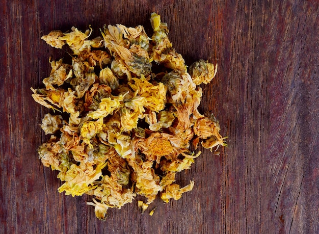 Chrysanthemum dried on wooden table