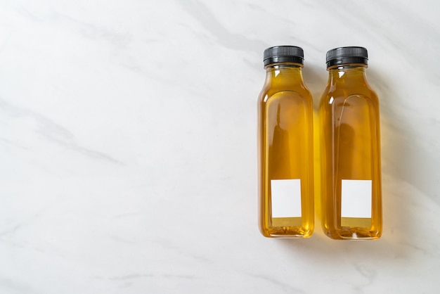 Chrysanthemum juice bottles on marble surface