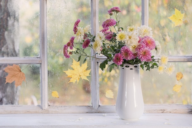 Chrysanthemums in a white vase