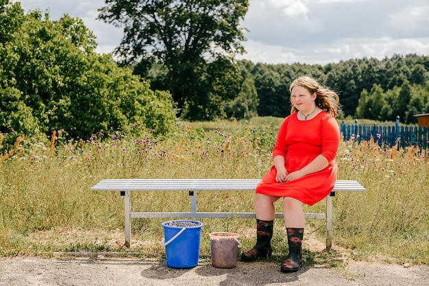 Chubby young girl sitting on the bench