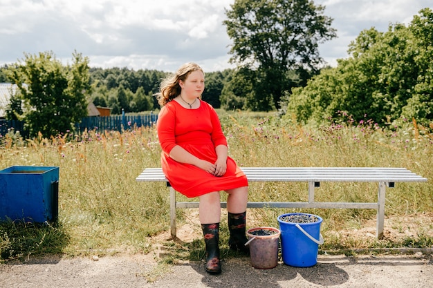 Chubby young girl sitting on the bench