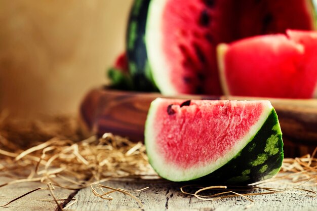 Chunks of of watermelon rustic style old wooden background selective focus