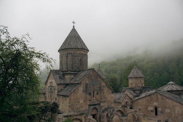 Church in the forest during fog