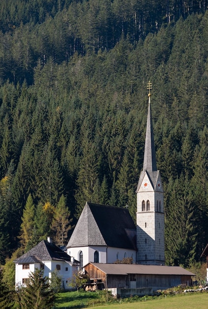 Church on Gosau village outskirts near forest Austria