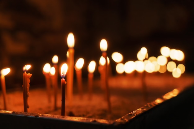 Church memorial candles are lit in the church