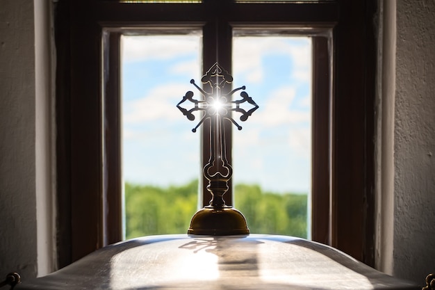 Church orthodox cross opposite window