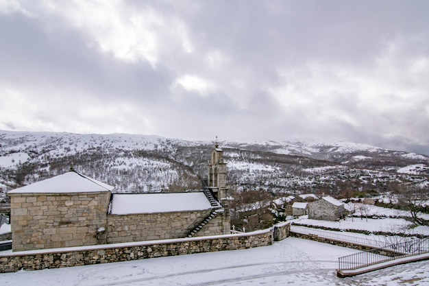 Church of Padornelo after a snowfall in winter