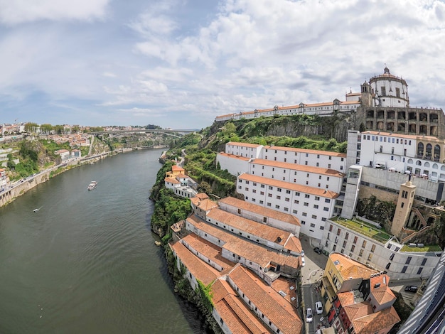 Photo church of saint augustin igreja do mosteiro de santo agostinho da serra do pilar porto portugal view from bridge on the douro river cityscape