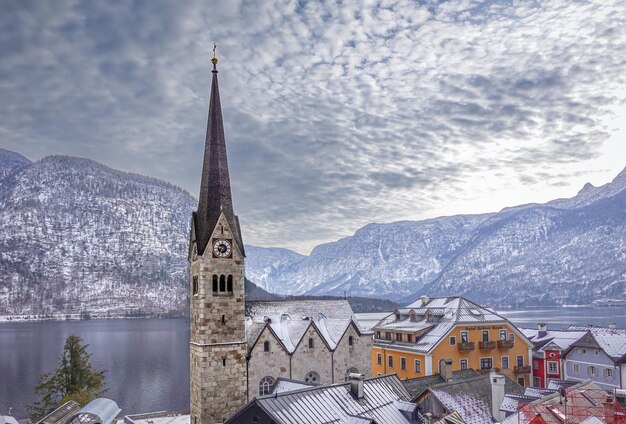 A church in the snow with a mountain in the background