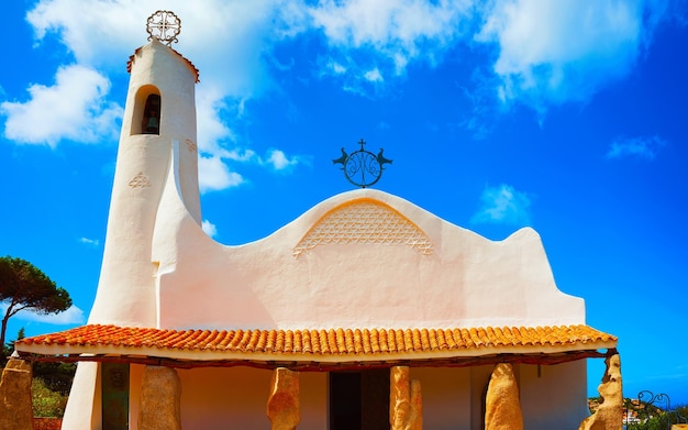 Church of Stella Maris in Porto Cervo on Sardinia Island of Italy in summer. Cathedral View on Sardinian town in Sardegna. Olbia province. Mixed media.