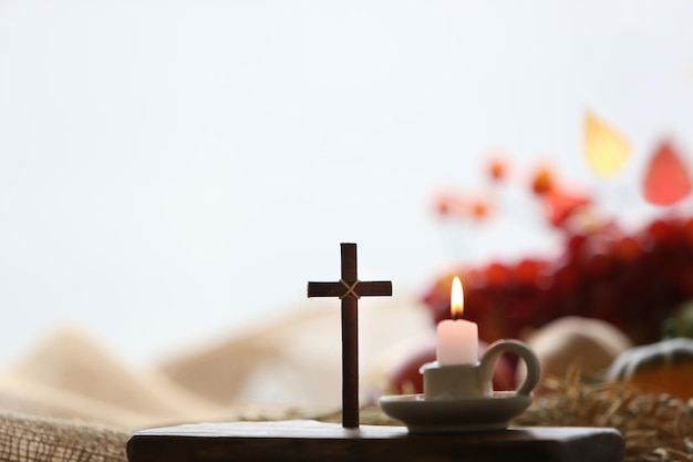 Church thanksgiving fruit decoration and background with candles and cross of Jesus