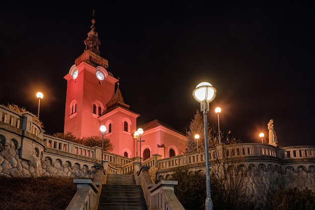 Church at town Ruzomberok Slovakia illuminated in red due event Red Wednesday 2020