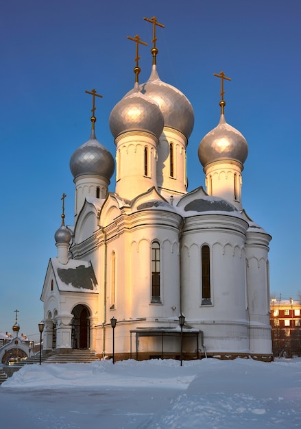 The church of virgin mary icon signabalatsk on the street\
teachers in the winter in the snow