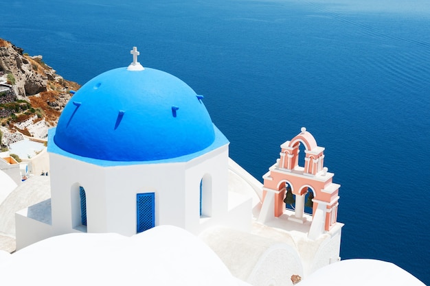 Church with blue domes on Santorini island, Greece. Beautiful landscape, sea view