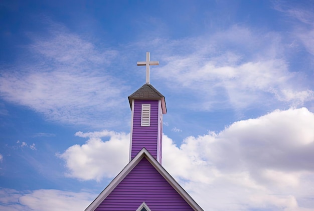 a church with a cross in the middle of a blue sky in the style of richly colored skies