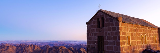 Church worship on greek orthodox chapel on mount sinai\
beautiful dawn in egypt early morning view of the top of\
mountain