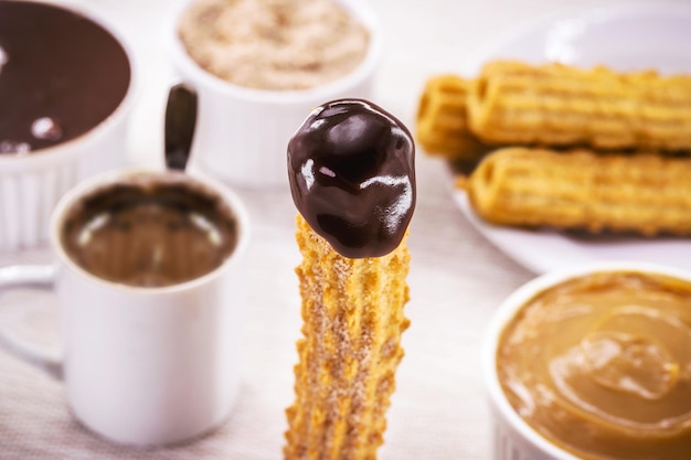 Churros fried candy filled with creamy chocolate covered in sugar tradition at popular parties or breakfast