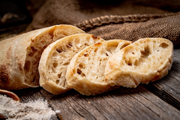 Photo ciabatta bread on the wood tabled