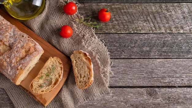 Ciabatta bread on wooden cutting board with copyspace Top view