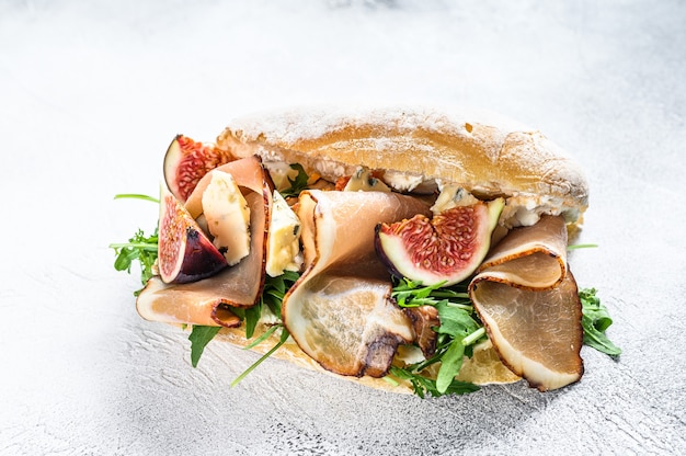 Ciabatta sandwich with arugula, fig, prosciutto and blue cheese