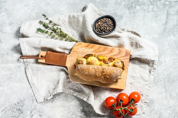 Ciabatta sandwich with meatballs, cheese and tomato sauce. Top view