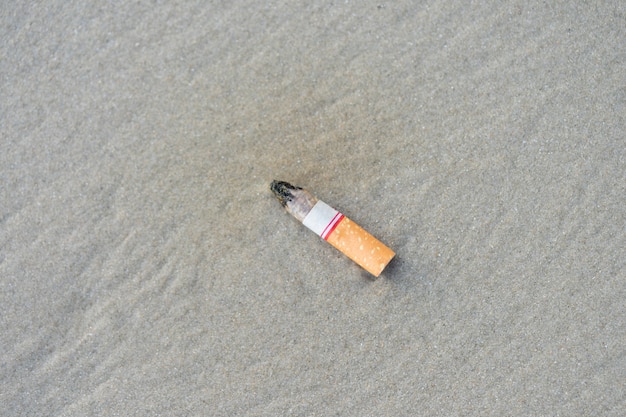 The cigarette butts have been successfully smoked. Left beach Is polluting 