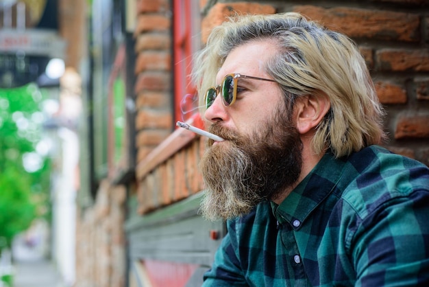 Cigarette close up portrait of smoking man sensual hipster with cigarette bearded man smoke the