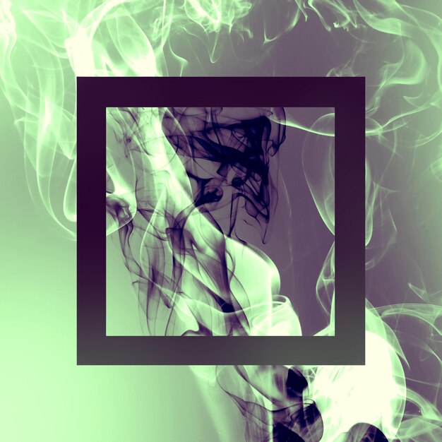 Cigarette smoke over blacl wall Healthcare nonsmoking addictions concept Abstract background for posters and flyers