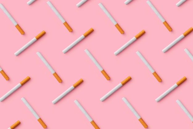 Photo cigarettes arranged on pink background