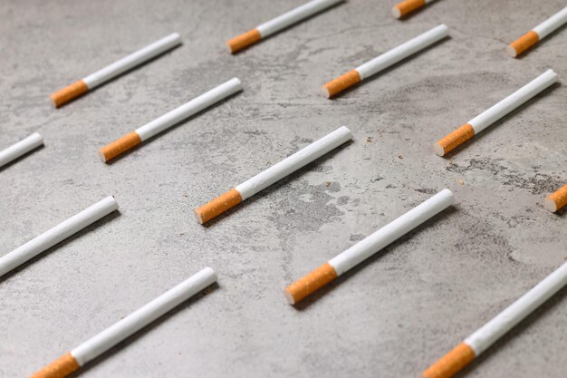 Cigarettes pattern on gray rustic background
