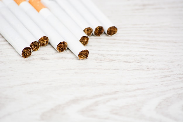 cigarettes on white wooden table.Copy space