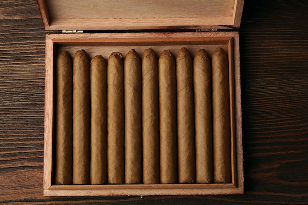 Cigars on wooden table closeup