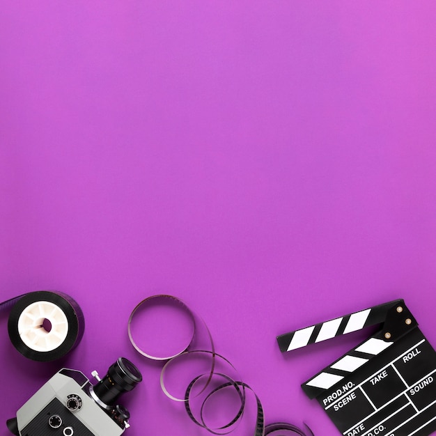 Cinema elements on purple background with copy space