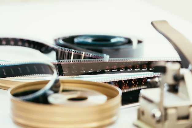 Photo cinema film reel or filmstrip on a cutting table