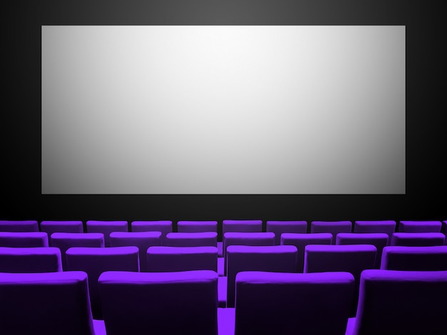 Cinema movie theatre with purple velvet seats and a blank white screen. Copy space background